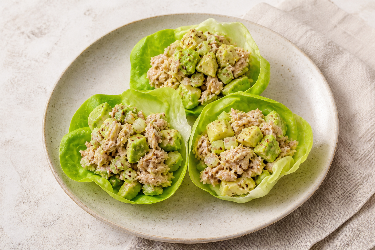 Tuna and avocado salad served in crisp lettuce cups